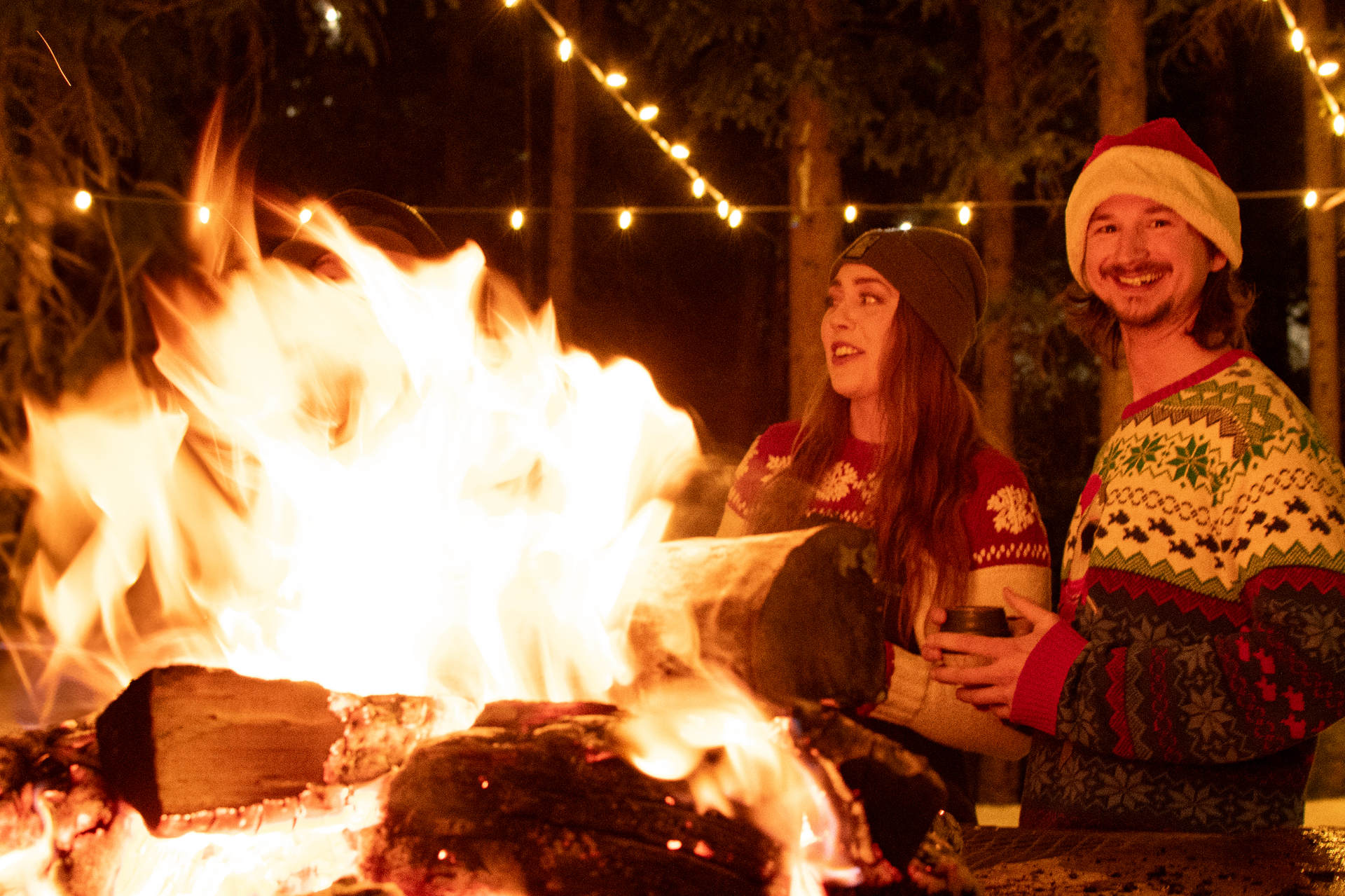Couple by the fire at the Holiday House