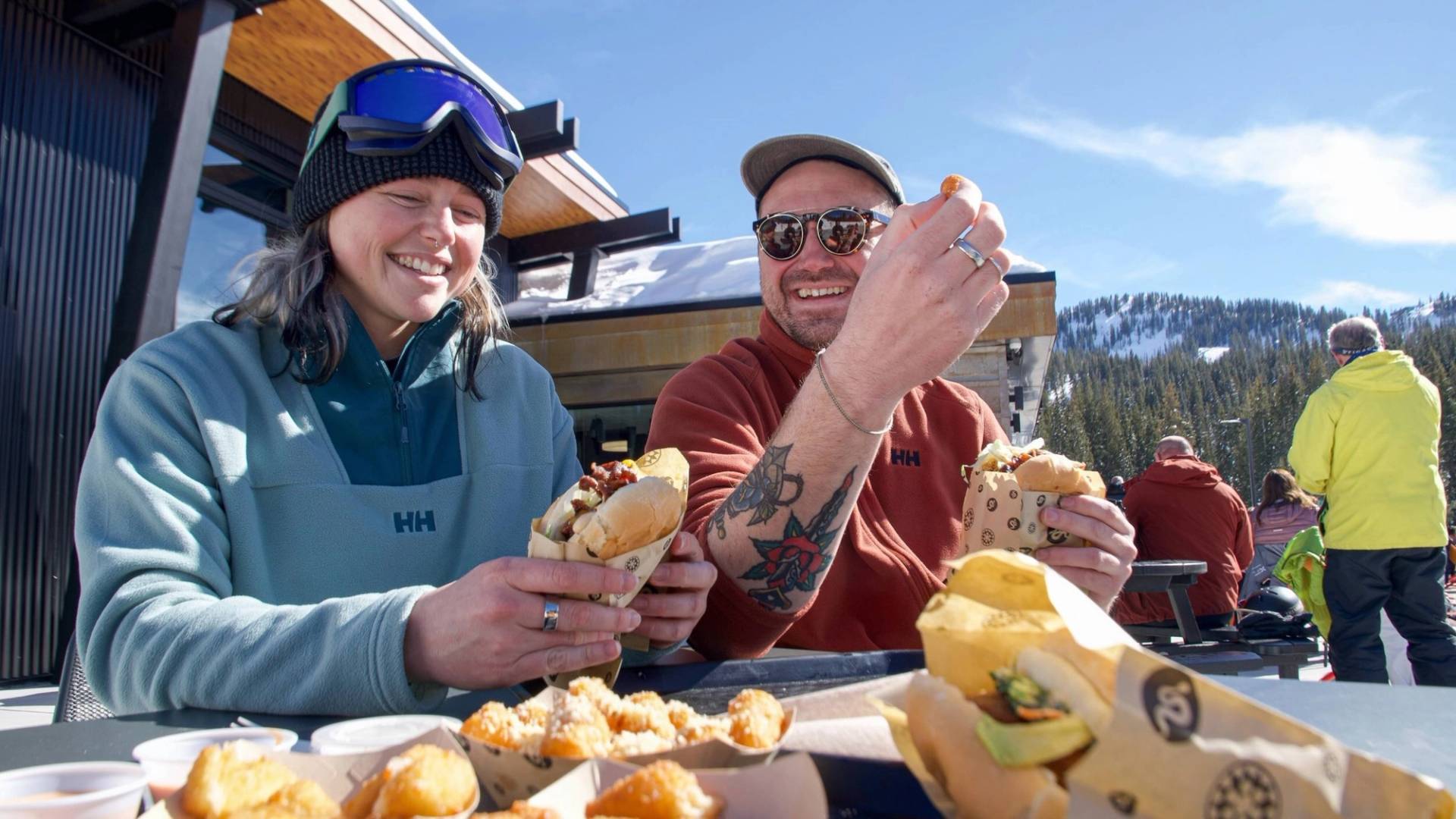 Friends eating a burger at the Sidewinder