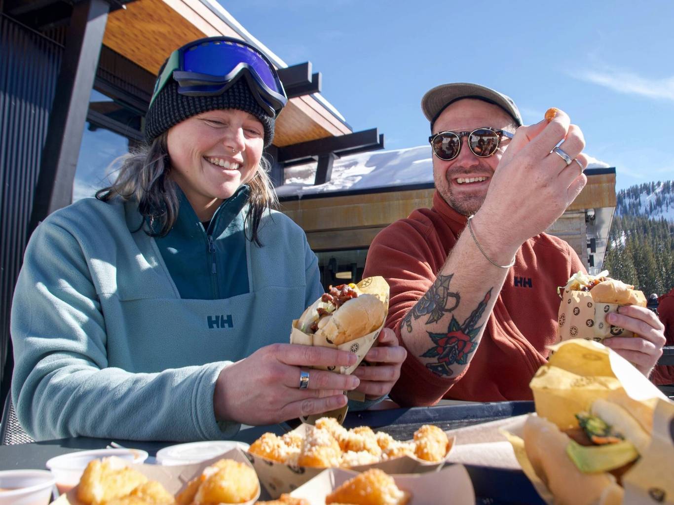 Friends eating a burger at the Sidewinder