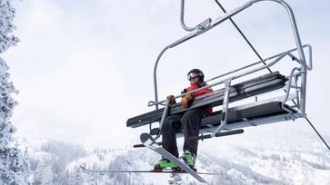 Ski Patrol riding the Great Western chairlift at Brighton