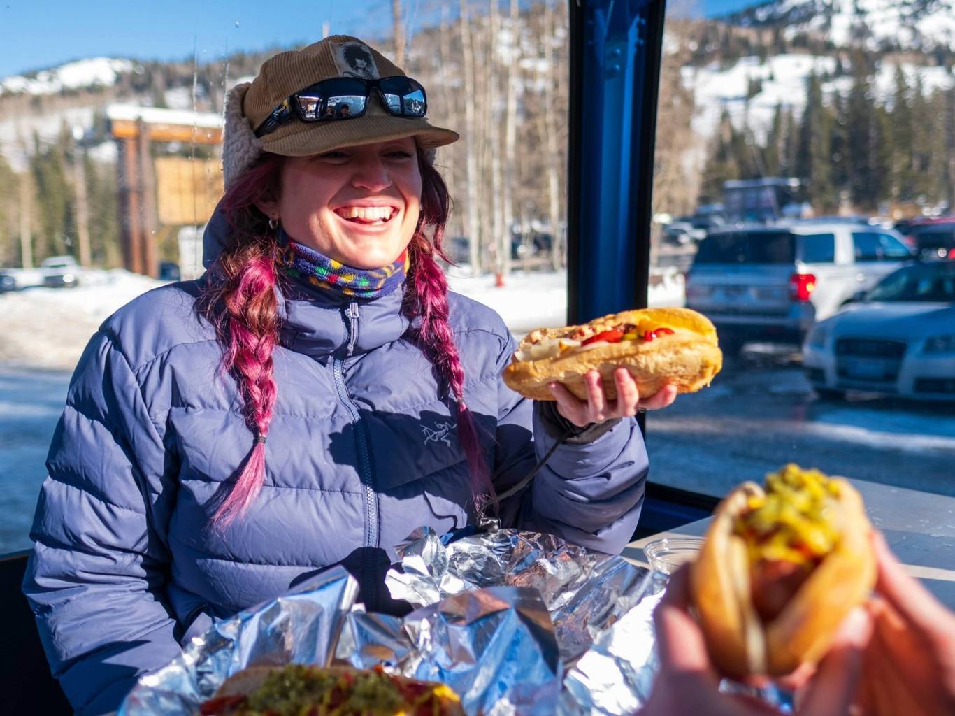 Girl eating hot dog at Doyle's Dawgs at Brighton Resort