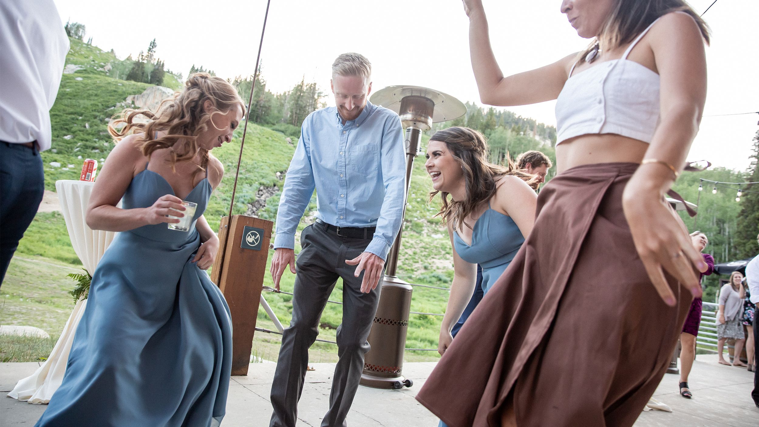 Dancing family at a wedding outside of Milly Chalet