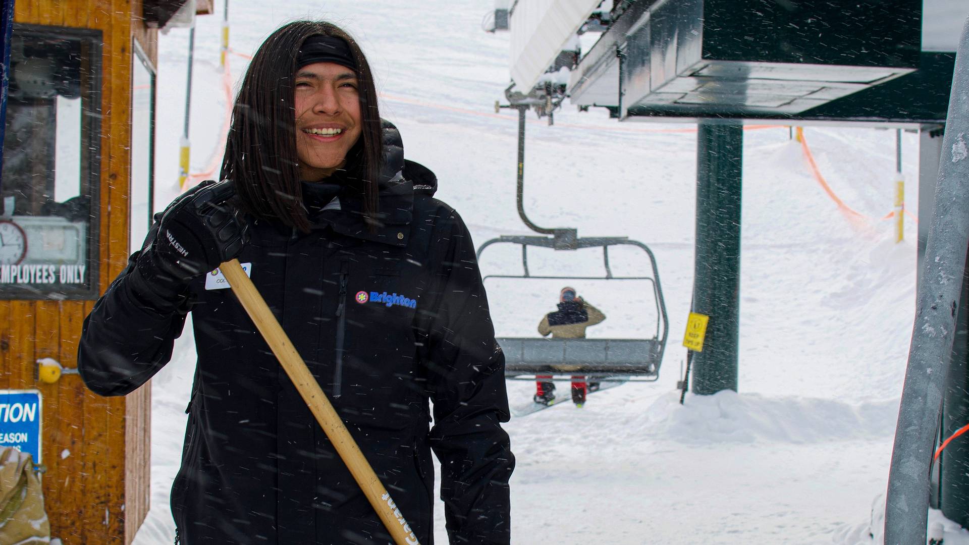 Brighton employee loading the lift at Brighton Ski Resort in Utah