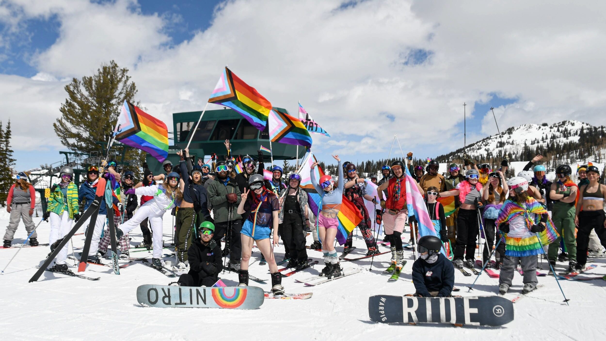 Group photo of Pride Ride at the top of Majestic