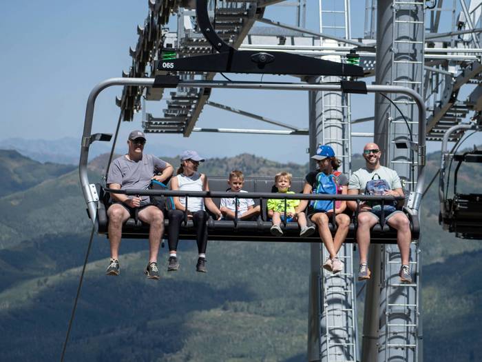 Family and friends on scenic lift ride at Brighton Resort in the summer