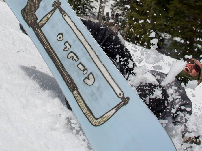 Snowboarder smiling in slush