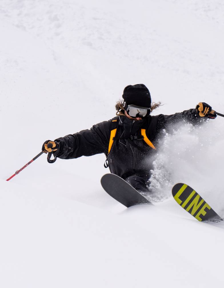 Deep snow skier riding Brighton Resort on a powder day