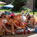 Group of friends on the Alpine Rose deck in the summer time at Brighton