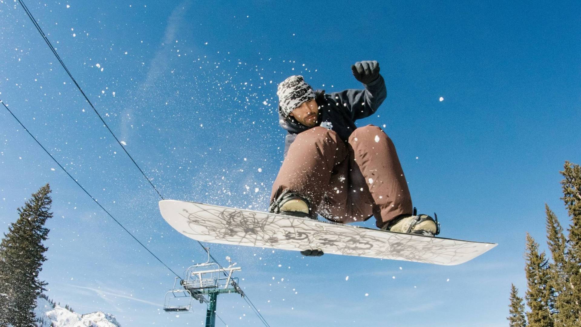 Snowboarder jumping in Brighton terrain park