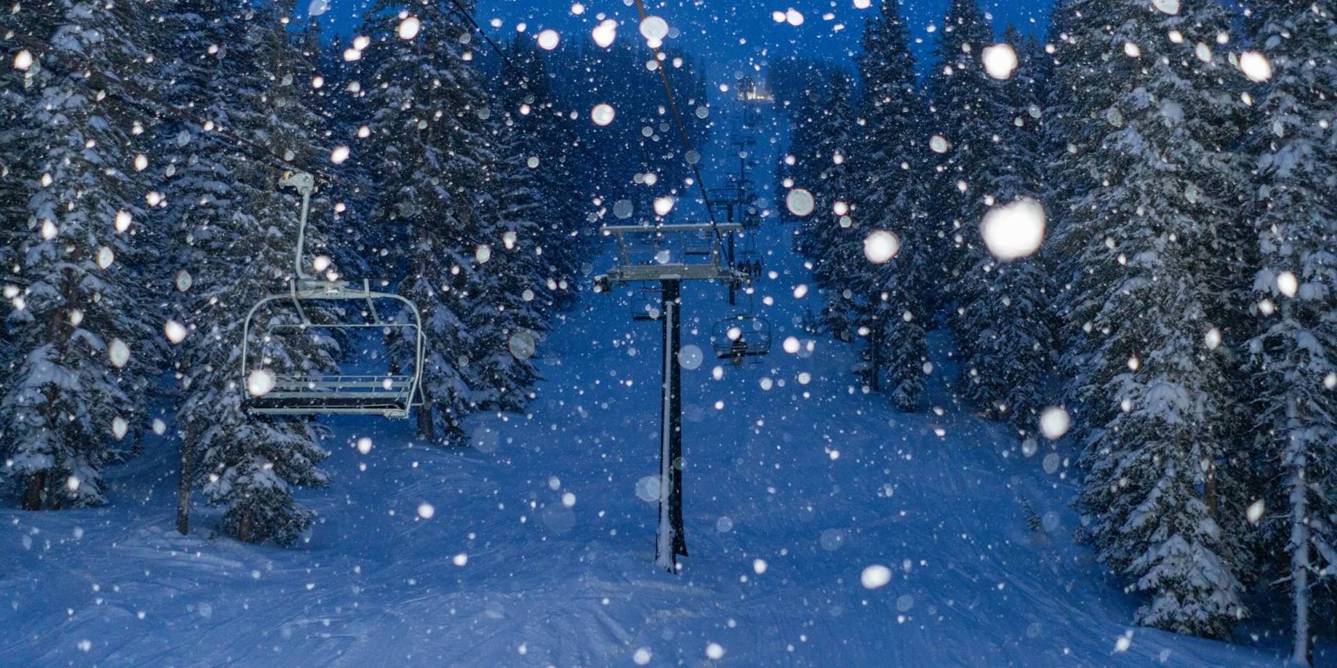 Scenic chairlift ride at night at Brighton Ski Resort