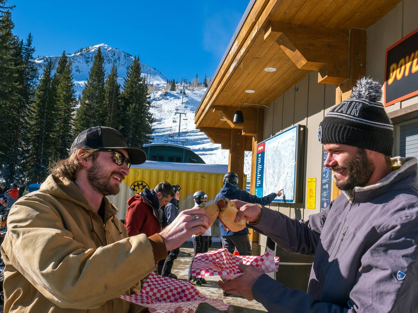 Friends eating at Doyle's Dawgs at Brighton Ski Resort in Utah
