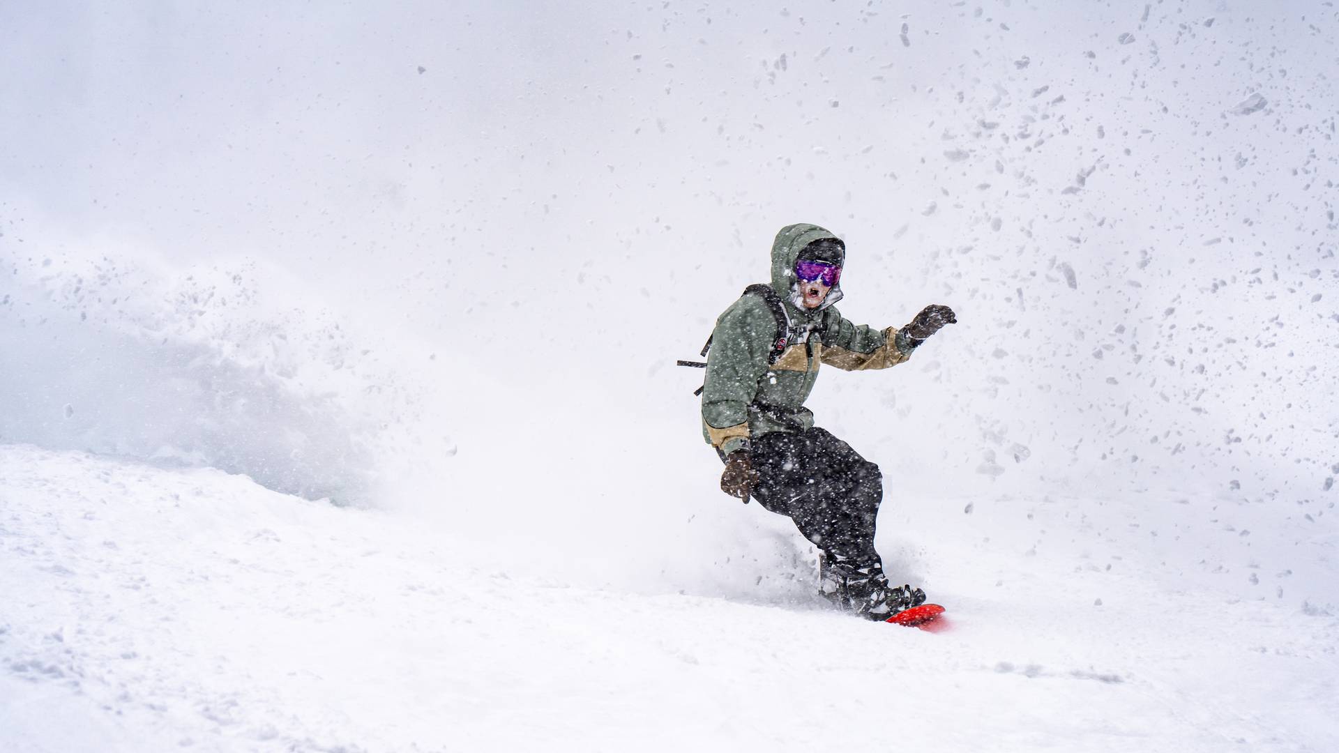 Snowboarder in powder at Brighton Resort