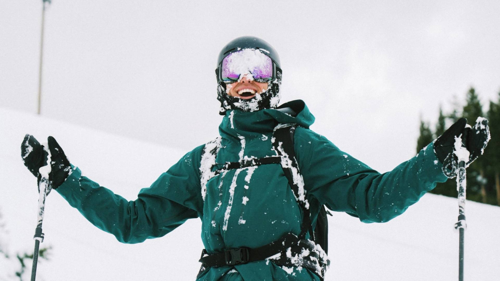 Skier smiling in snow at Brighton Resort Utah