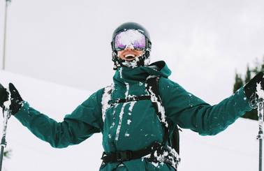 Skier smiling in snow at Brighton Resort Utah