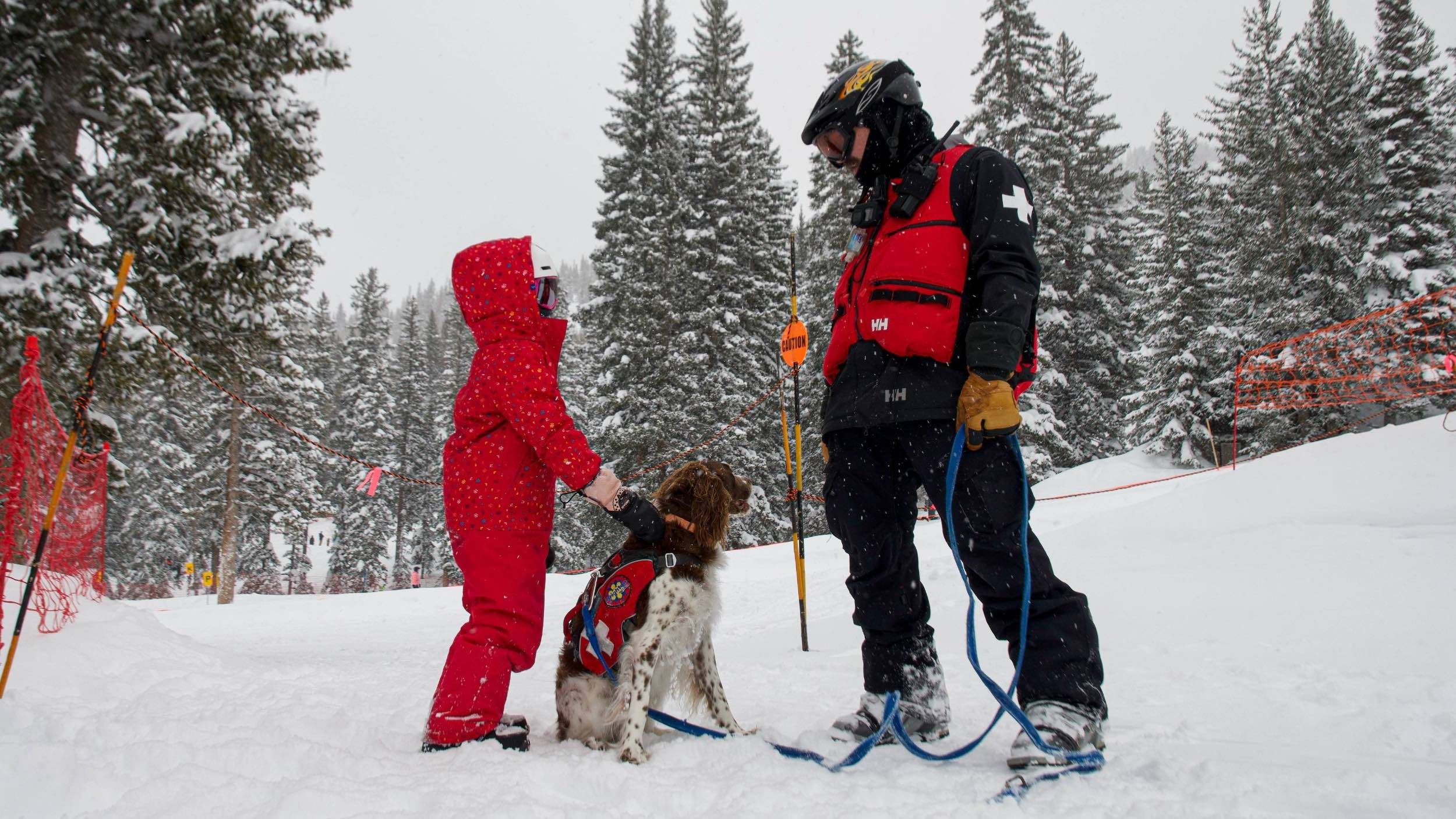 Brighton Ski Patrol with avy dog and kid skier