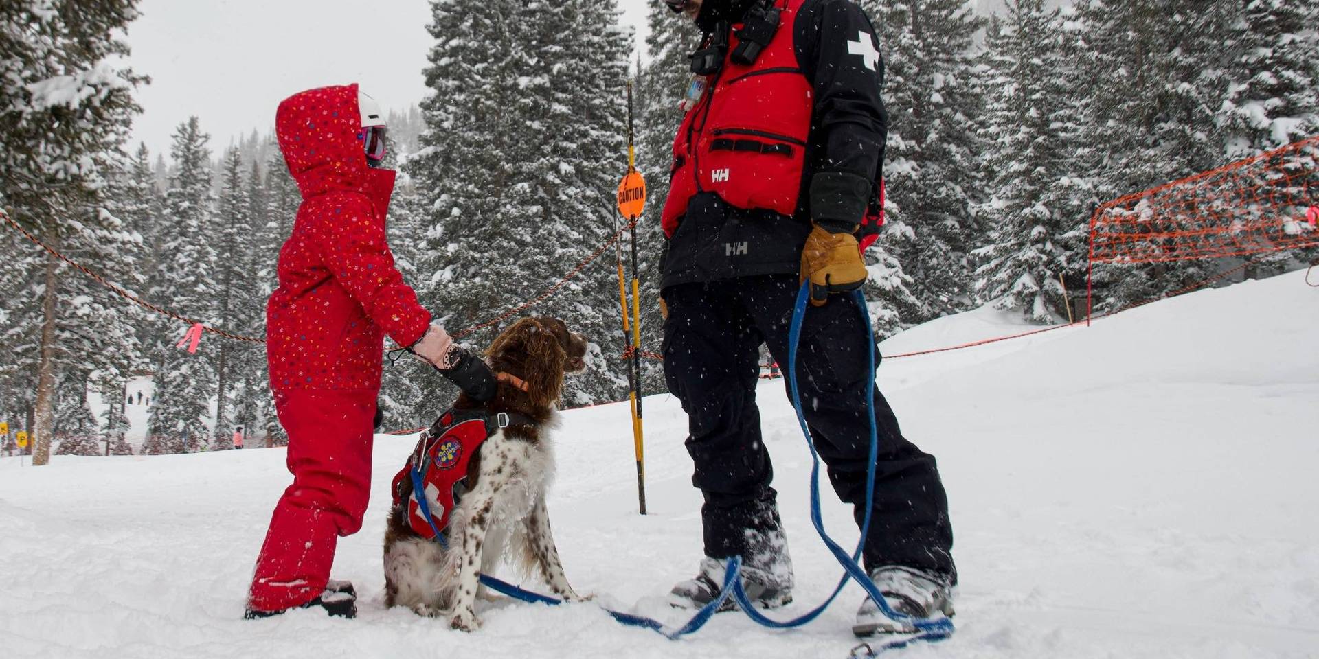Brighton Ski Patrol with avy dog and kid skier