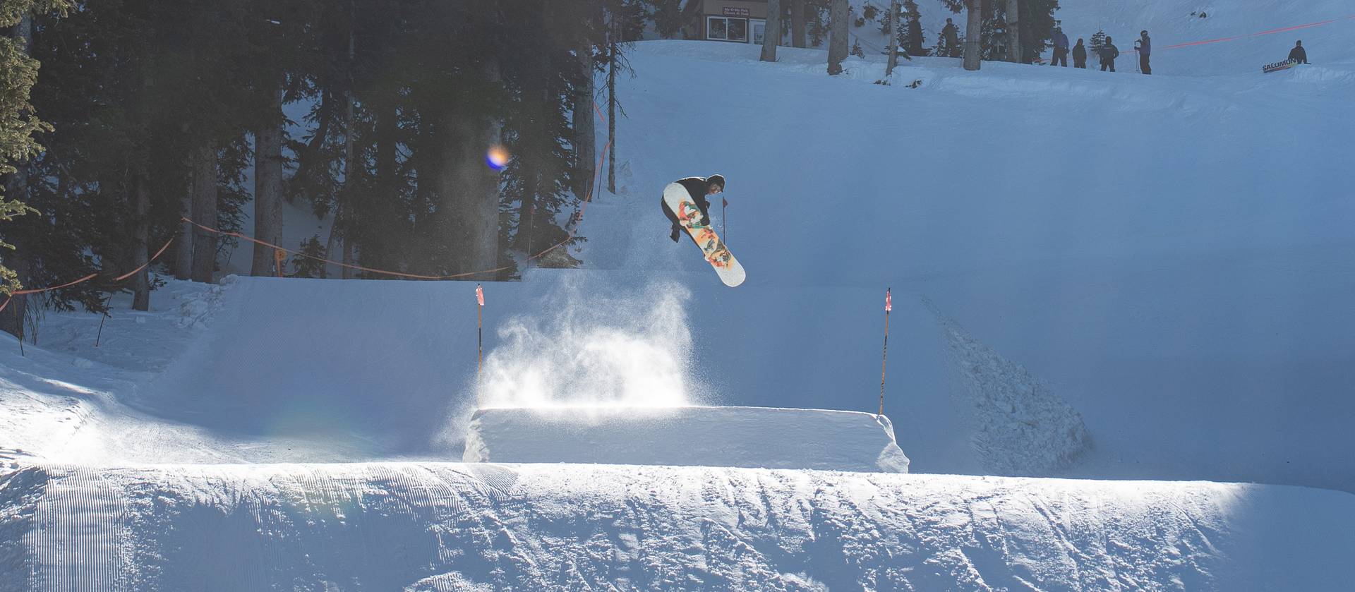 Snowboarder jumping on My Oh My terrain park