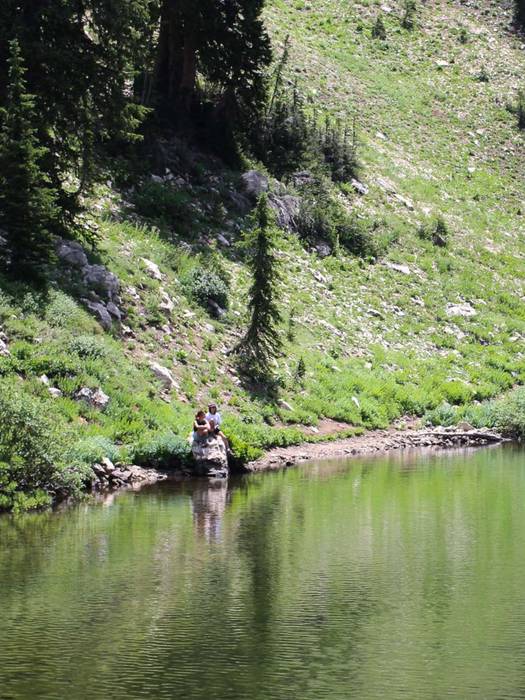 Friends hiking to Lake Catherine at Brighton Resort in the summer