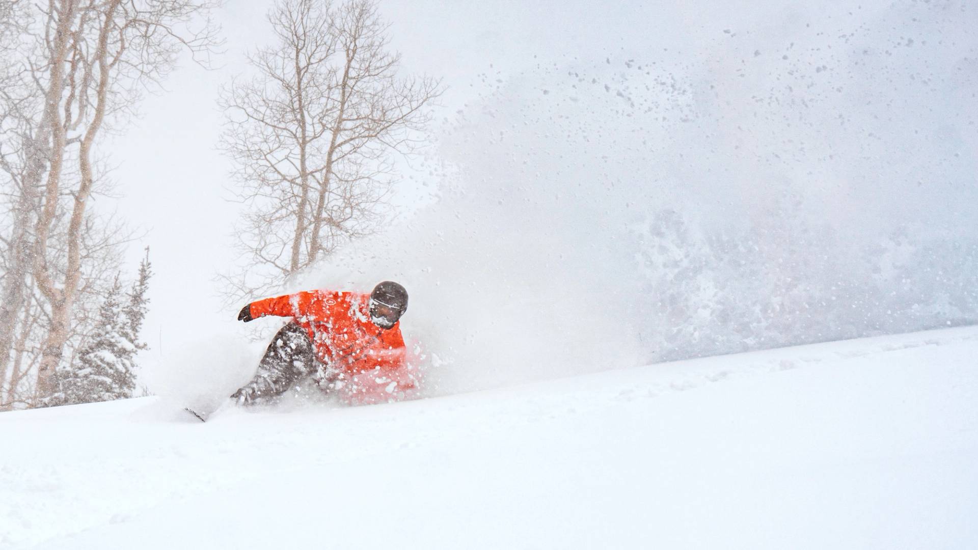 Group of friends on chairlift during a snow day at Brighton Ski Resort