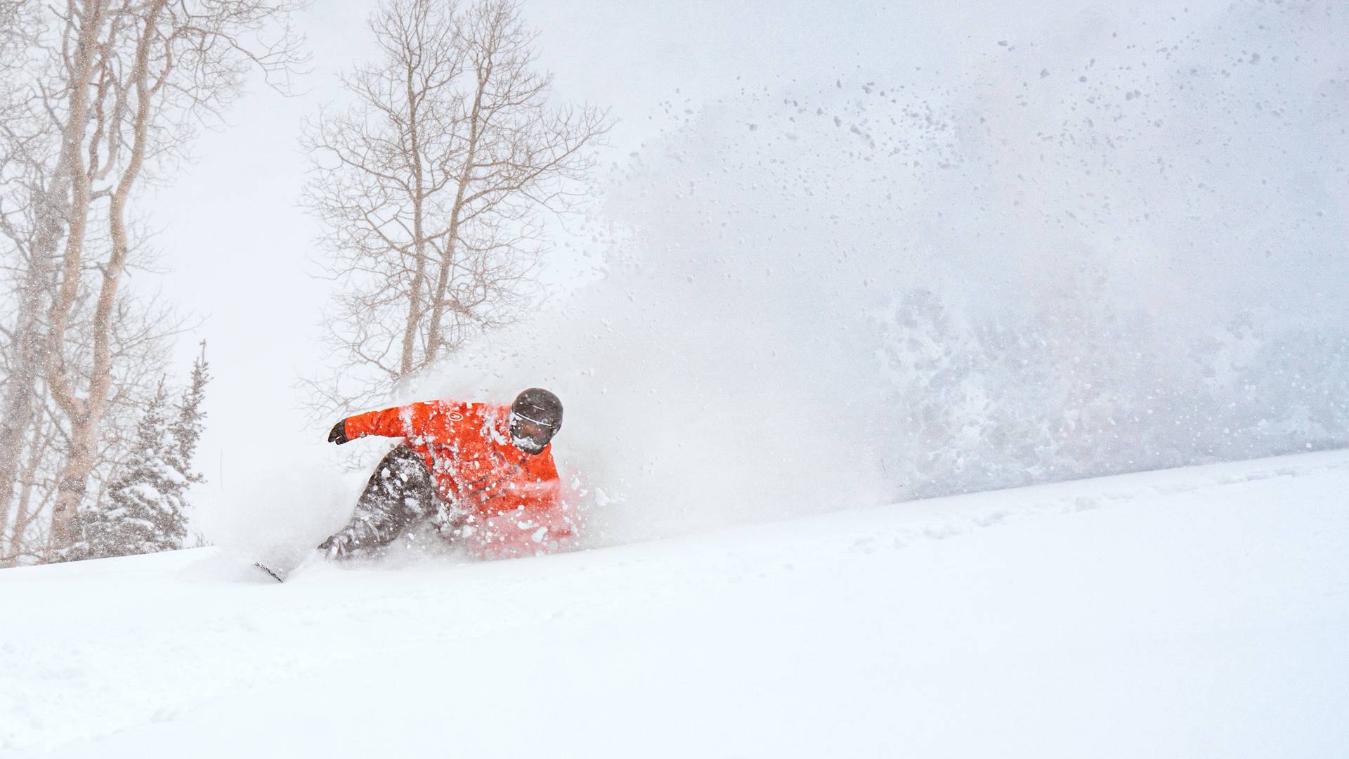 Group of friends on chairlift during a snow day at Brighton Ski Resort