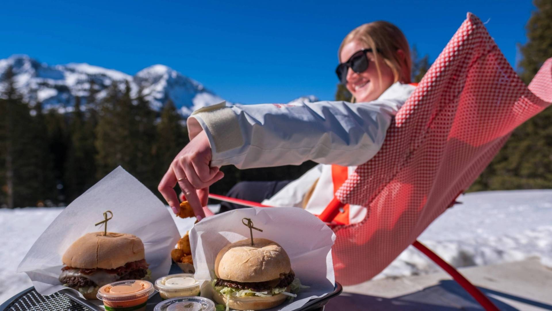 Friends eating a burger at the Sidewinder