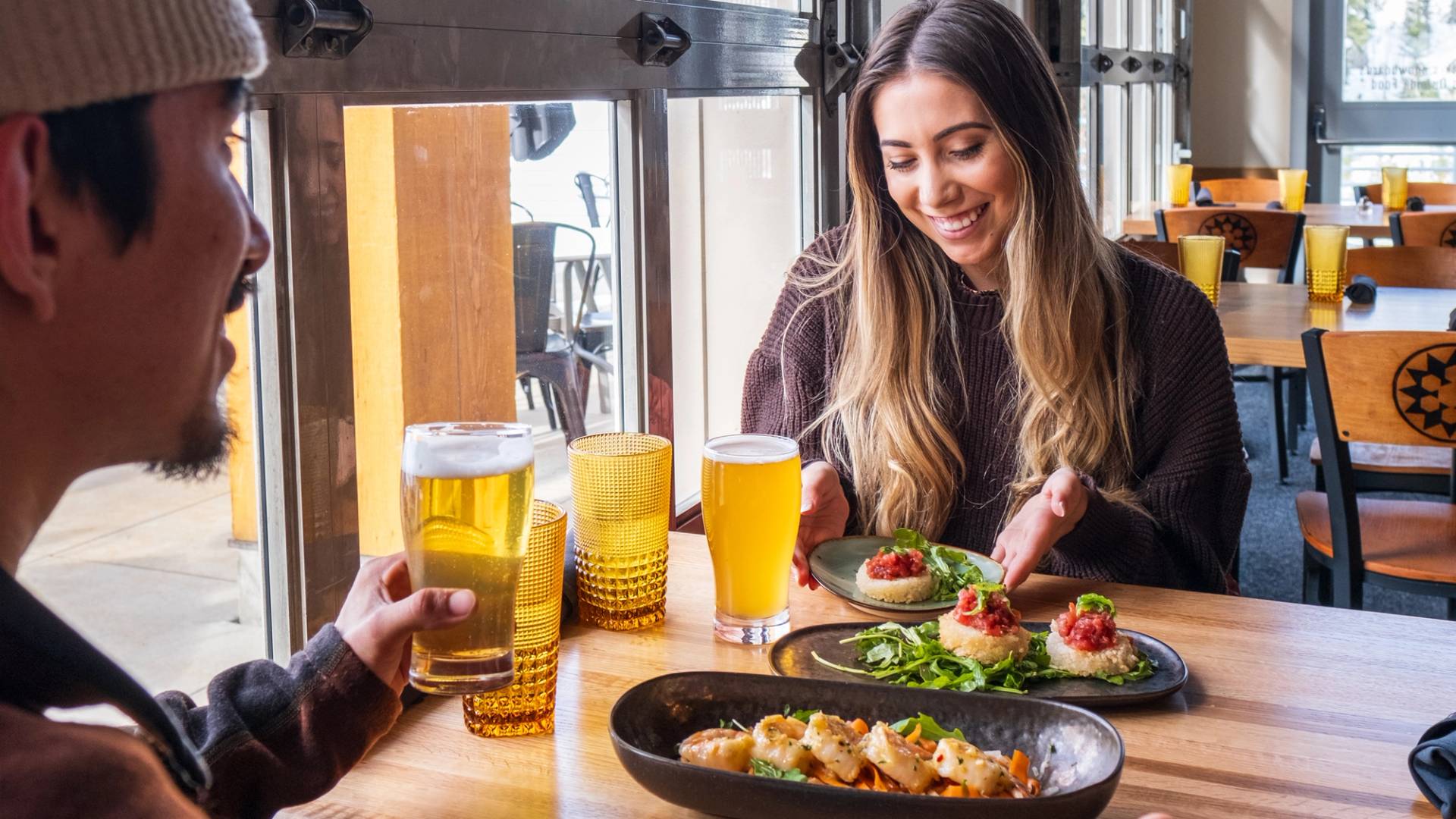 Couple enjoying lunch at the Milly Chalet in Brighton, Utah