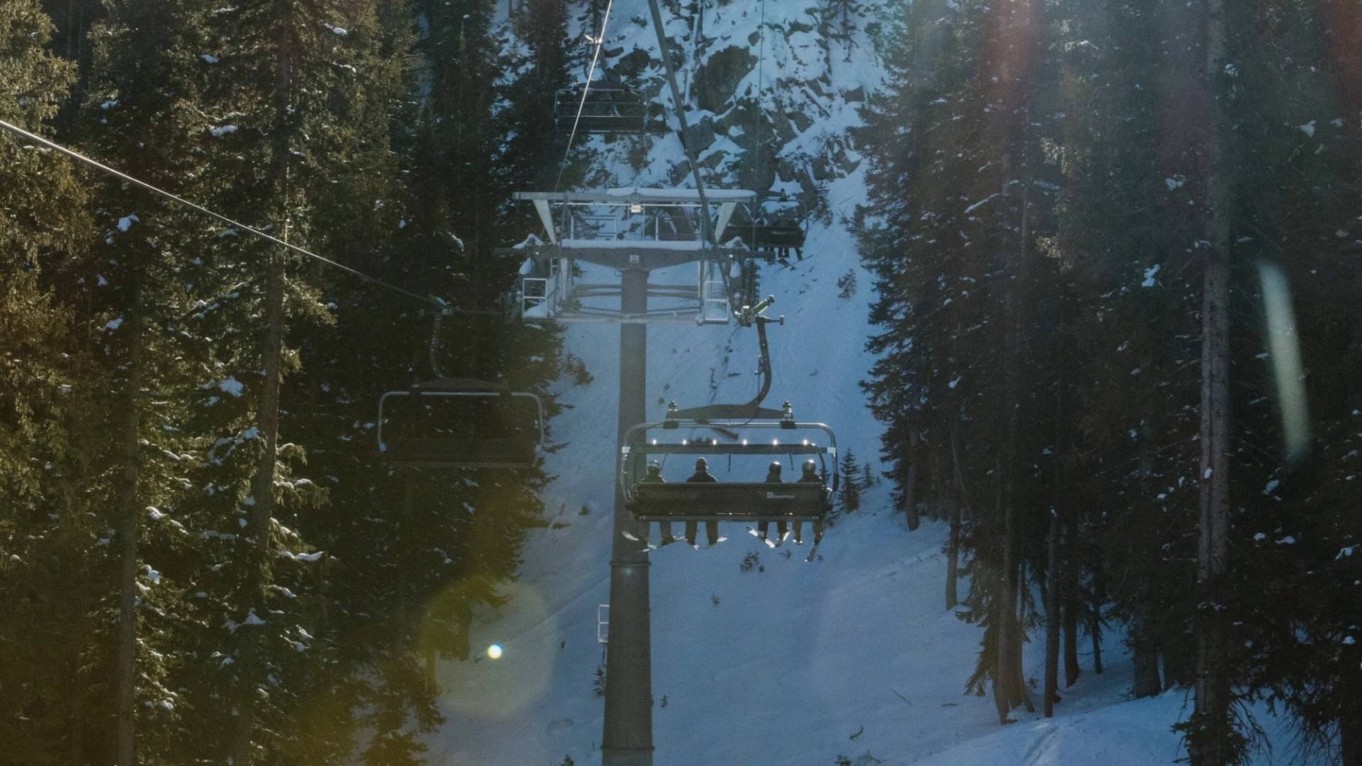 Sunny chairlift ride up to Snake Creek at Brighton Ski Resort