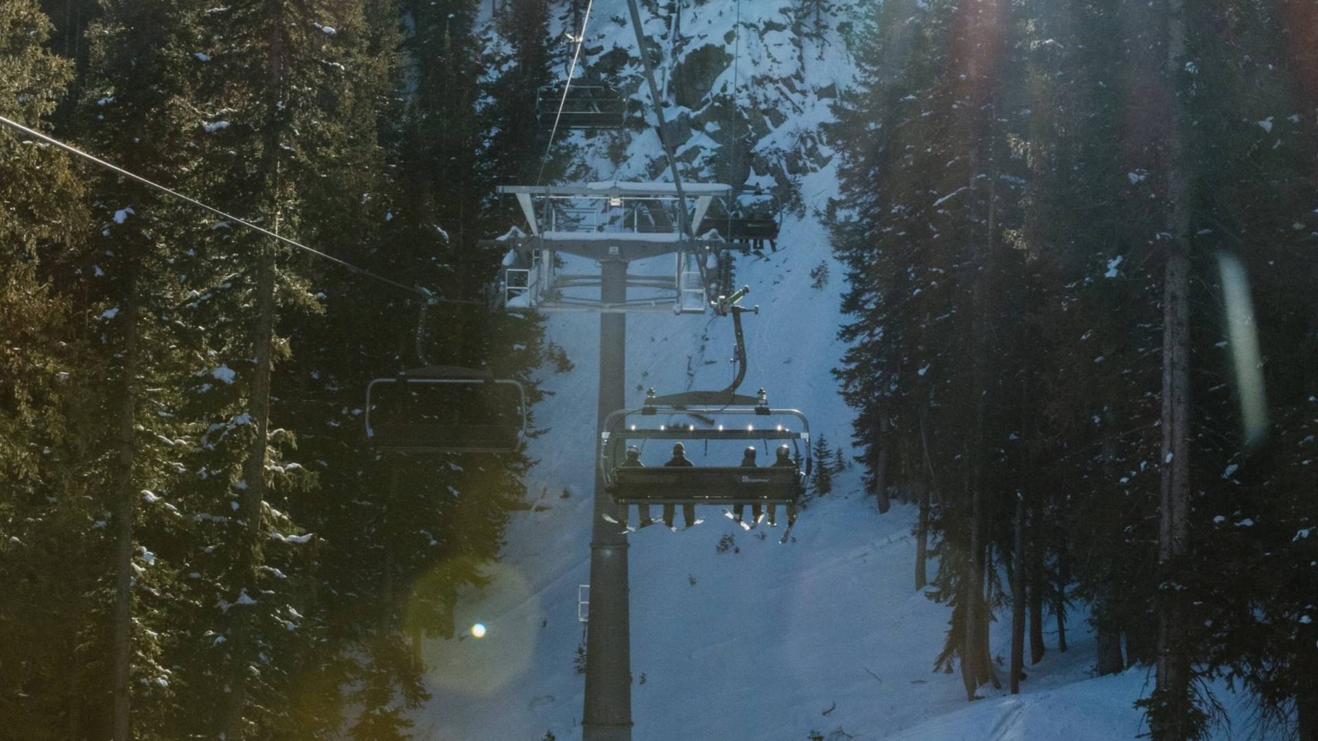 Sunny chairlift ride up to Snake Creek at Brighton Ski Resort
