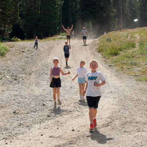 Family running the Majestic Scramble at Brighton Resort in the summer