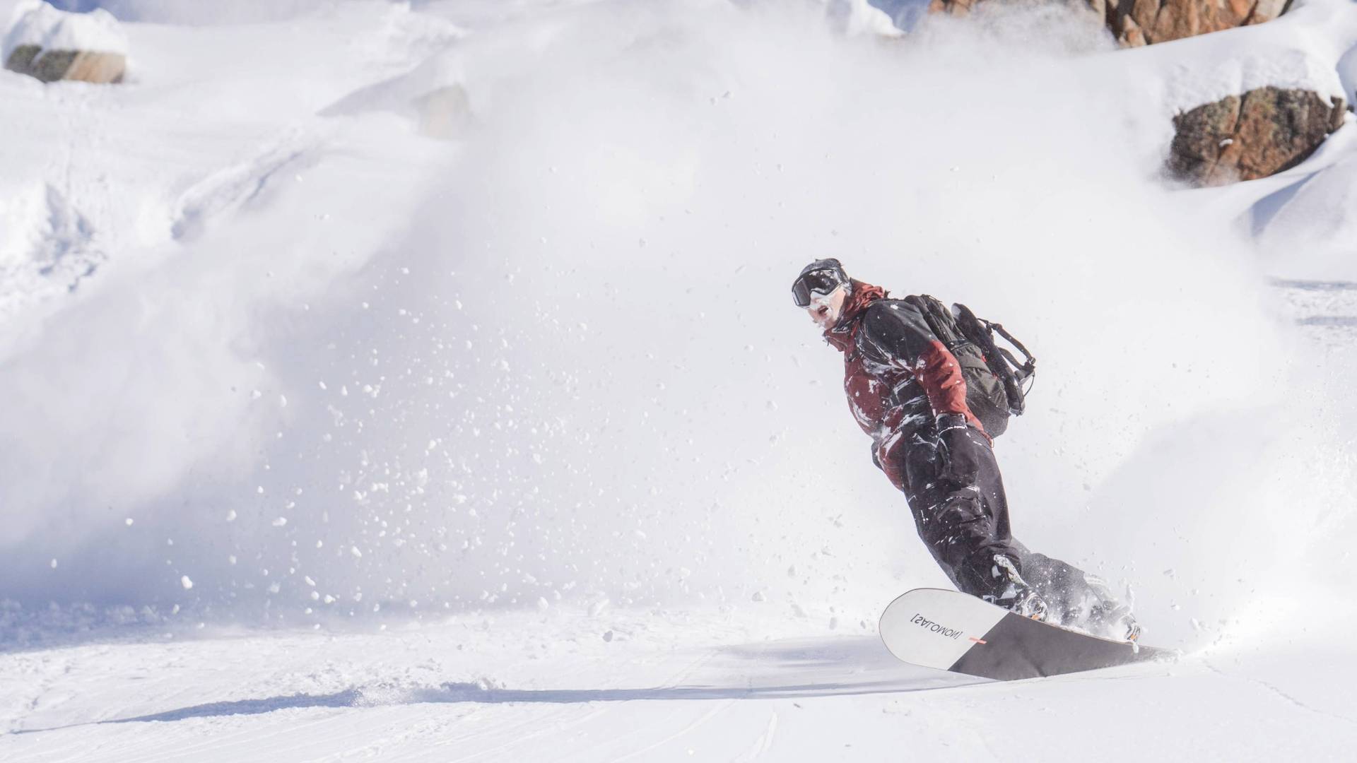 Snowboarder on Milly powder run at Brighton Resort