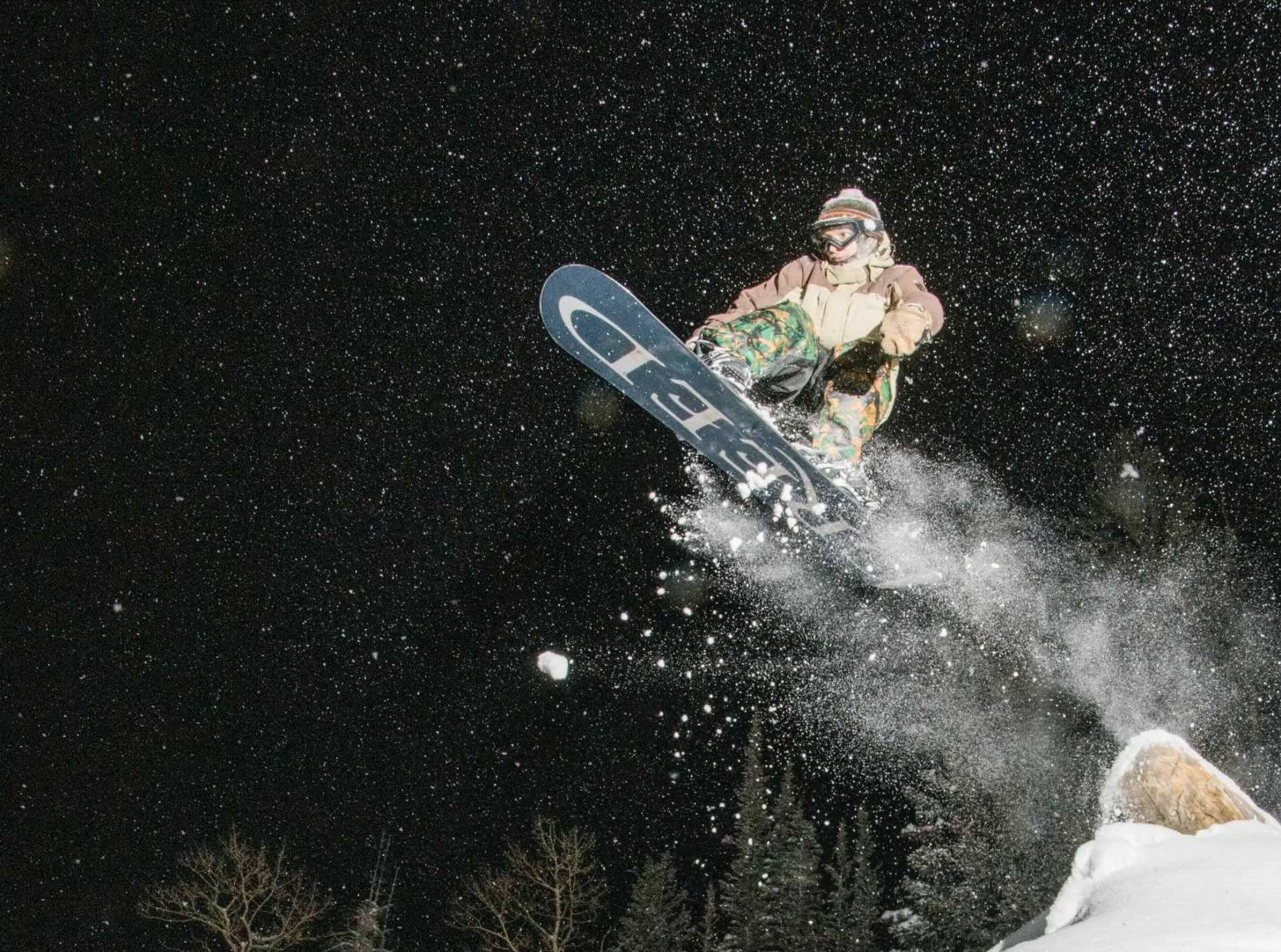 Snowboarder night riding at Brighton Ski Resort
