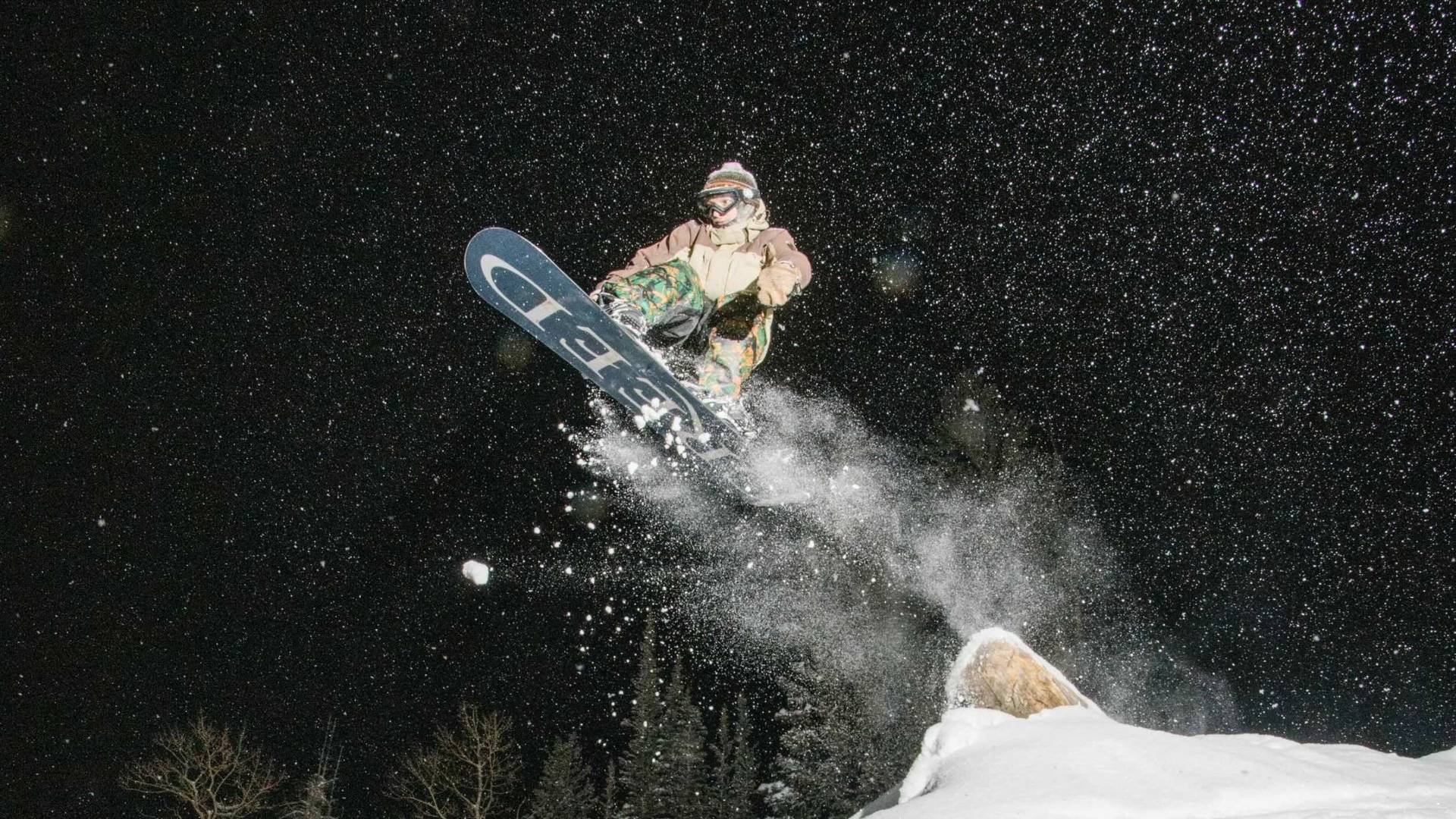 Snowboarder night riding at Brighton Resort
