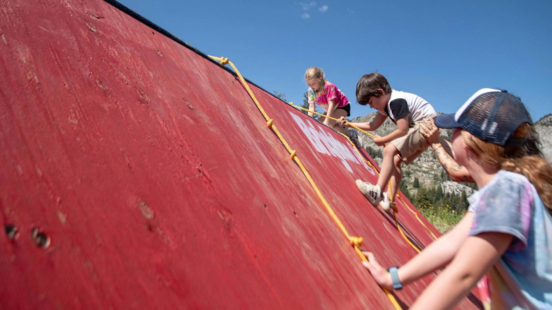 Kids climbing over 2k family fun obstacle course at Brighton Resort