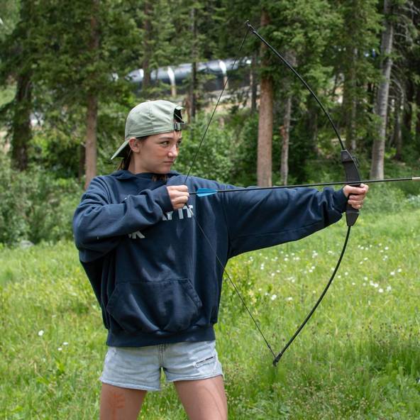 Girl with bow and arrow in Brighton summer camp