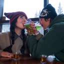 Couple enjoying green beer for St. Patricks Day at Brighton Ski Resort.