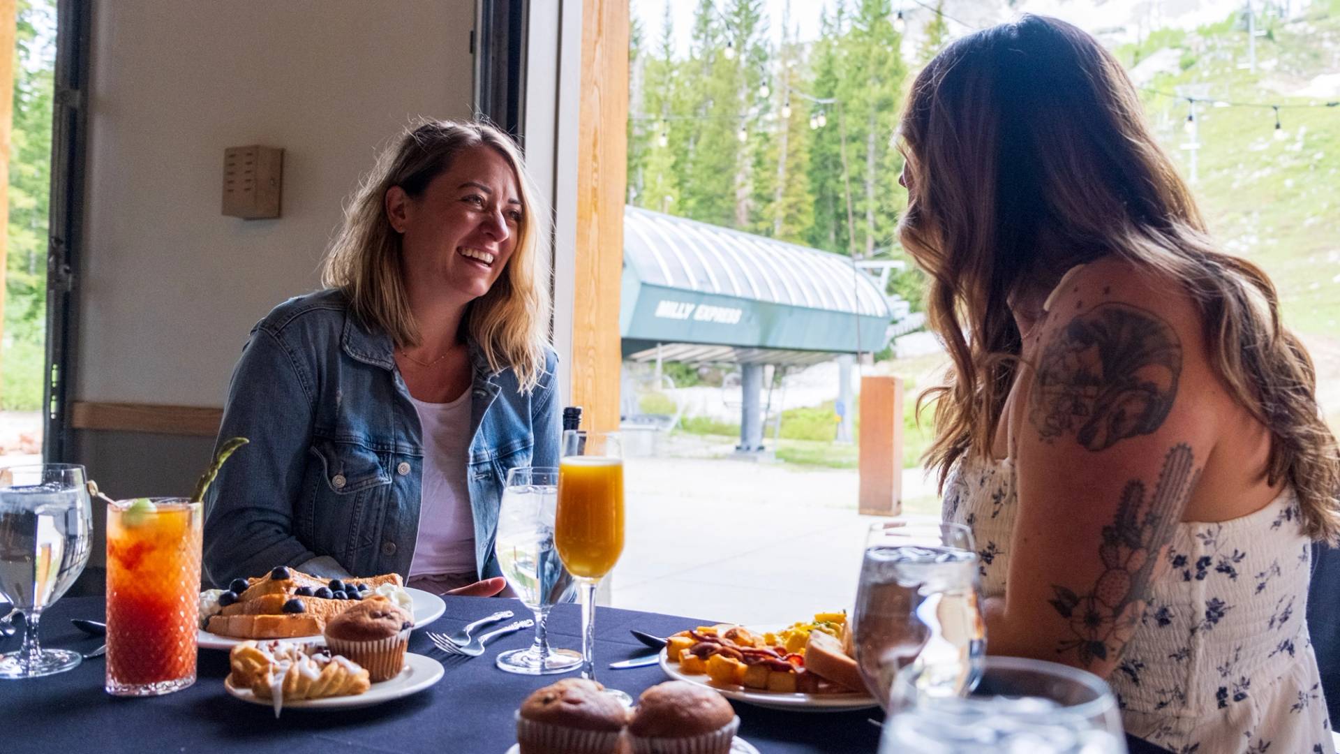 Friends eating and drinking at brunch