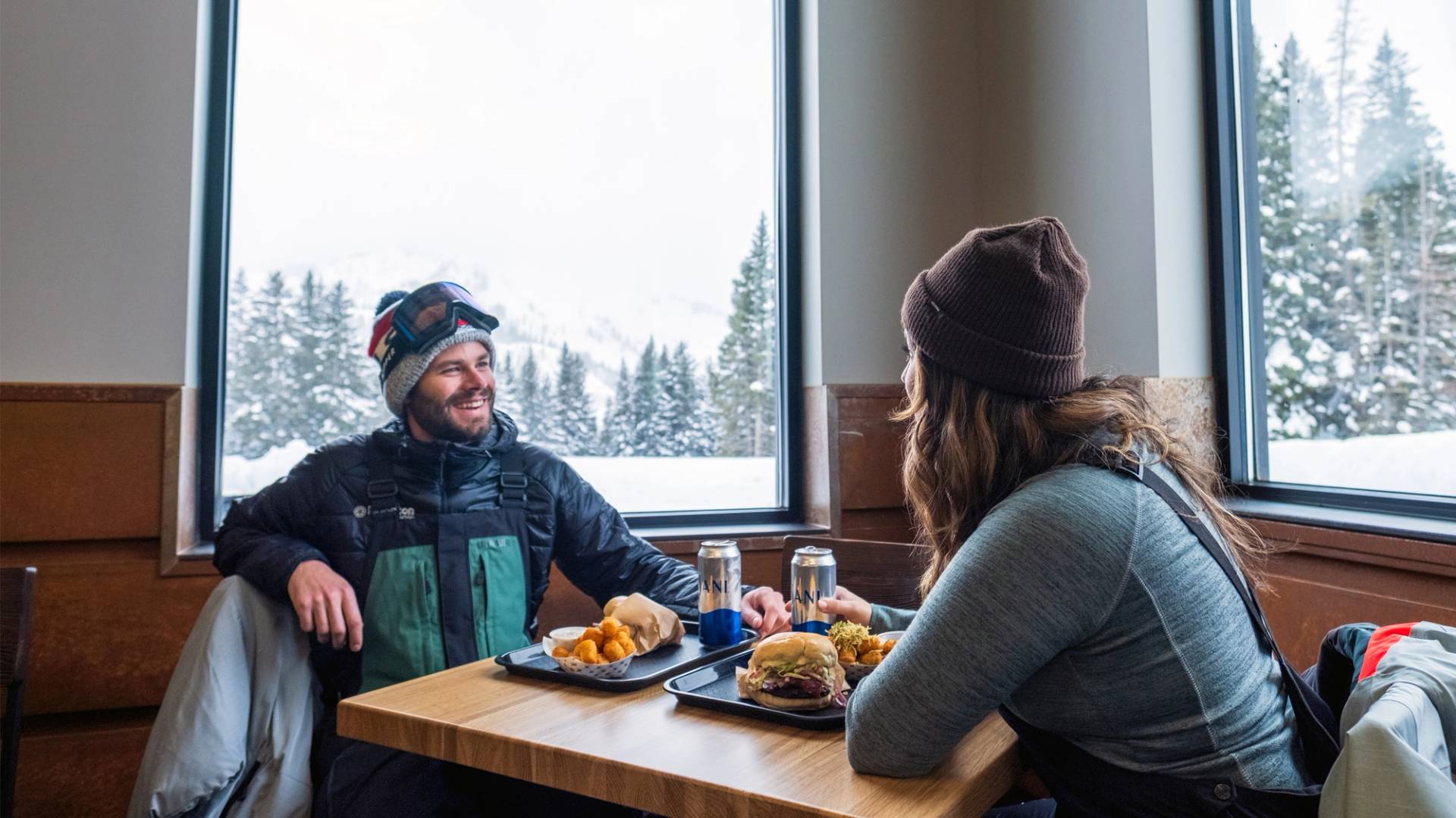 Couple having lunch in the Sidewinder at Brighton Ski Resort