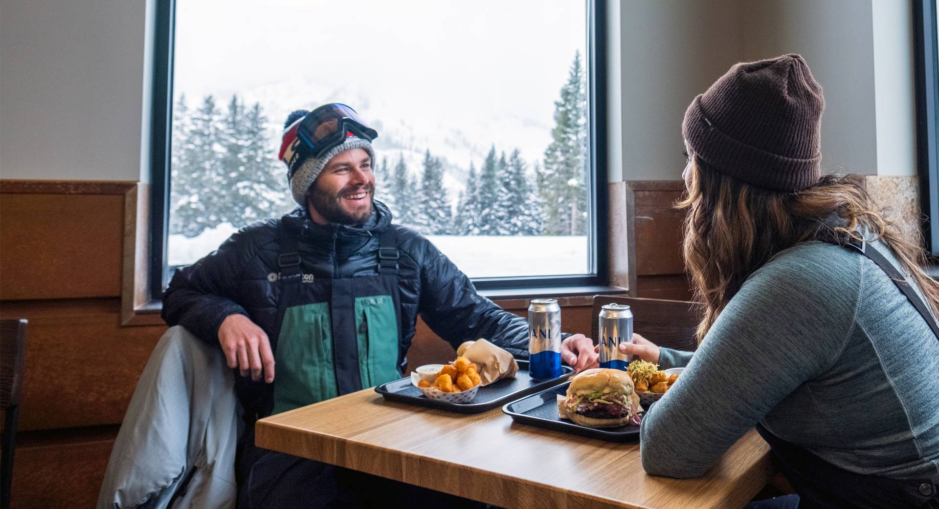 Couple drinking beers at the Milly Chalet