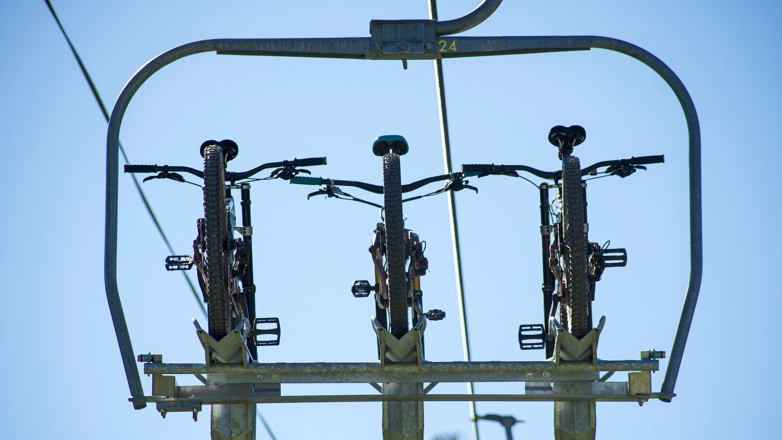 Mountain bikes loaded on chairlift at Brighton Resort in the summer