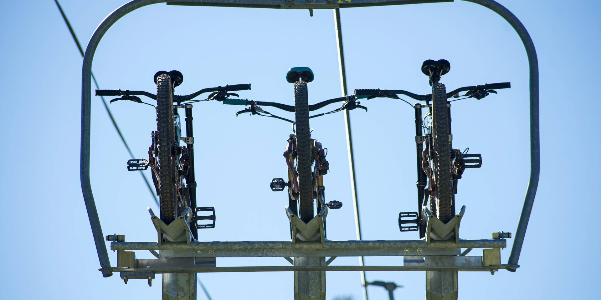 Mountain bikes loaded on chairlift at Brighton Resort in the summer