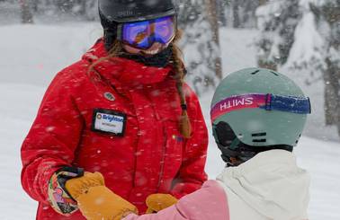 Brighton Ski School instructor with kid during lesson