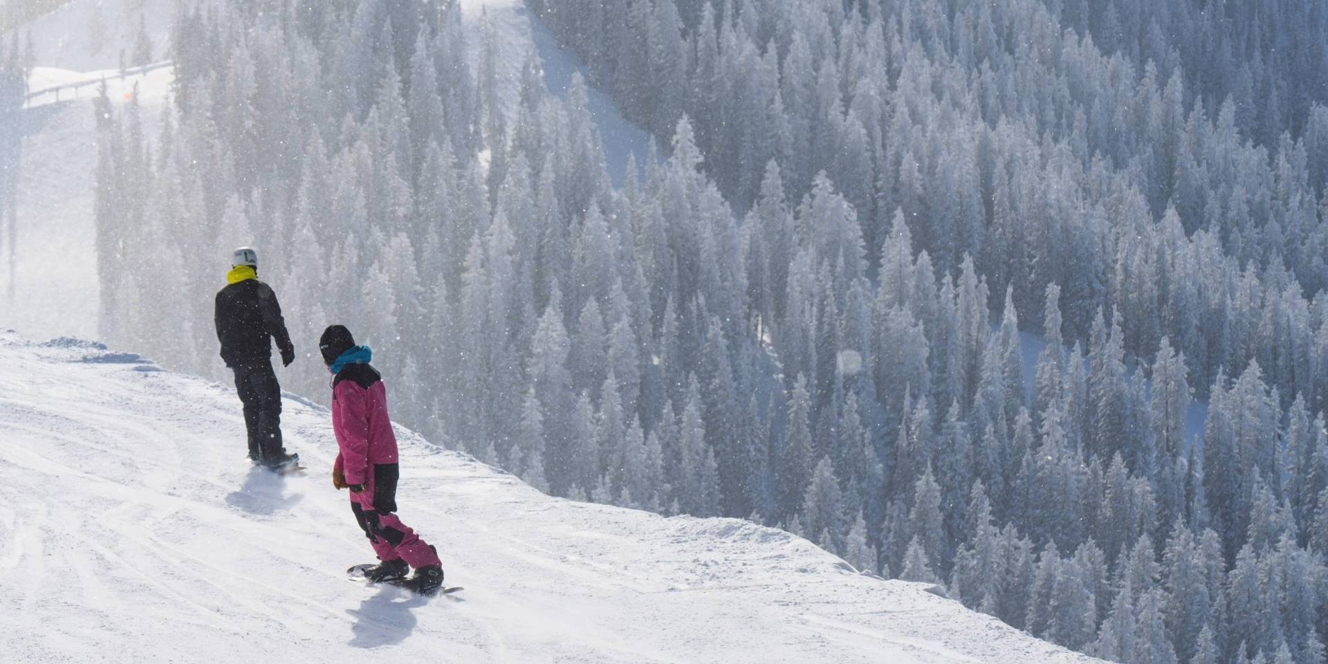 Snowboarders off of Great Western at Brighton Resort