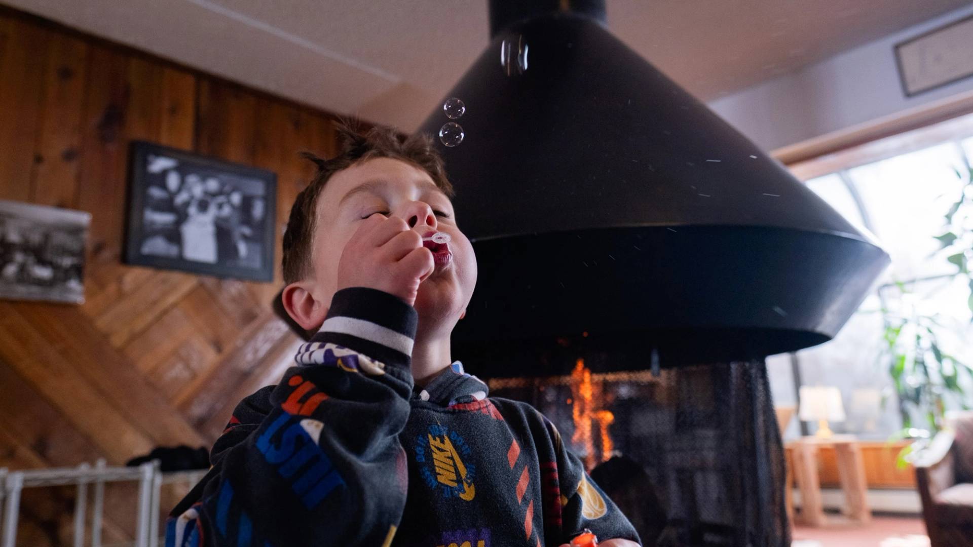 Kid blowing bubbles in the Brighton Lodge