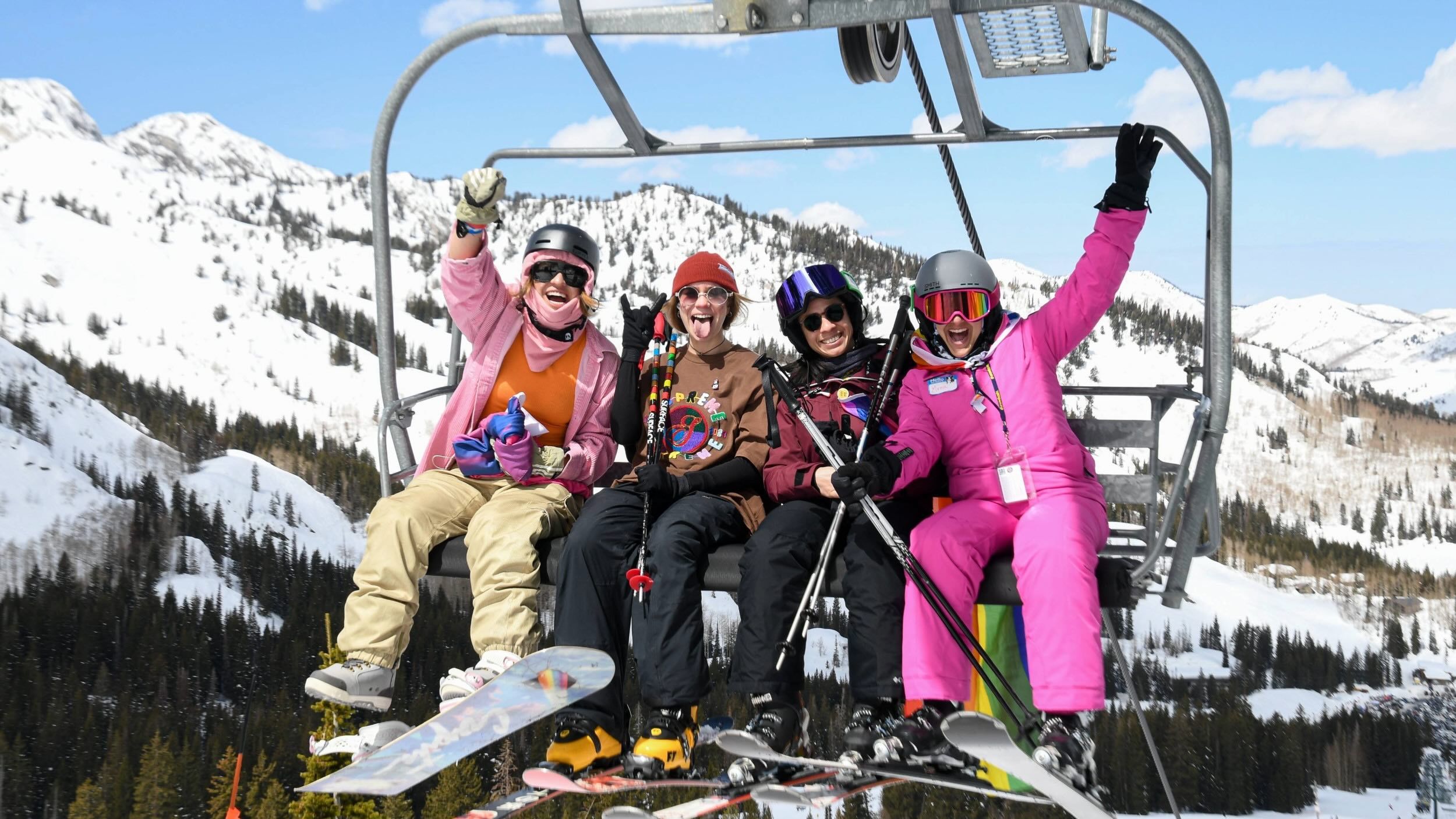 Group of friends taking chairlift to Pride Ride at Brighton
