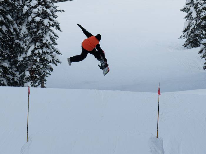 Snowboarder jumping on My Oh My