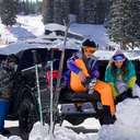 Friends putting on gear in the parking lot