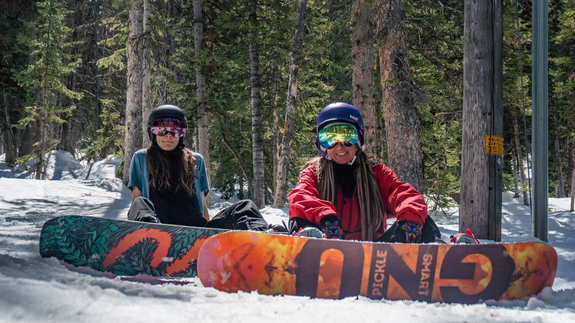 Friends snowboarding in the trees of Brighton Ski Resort