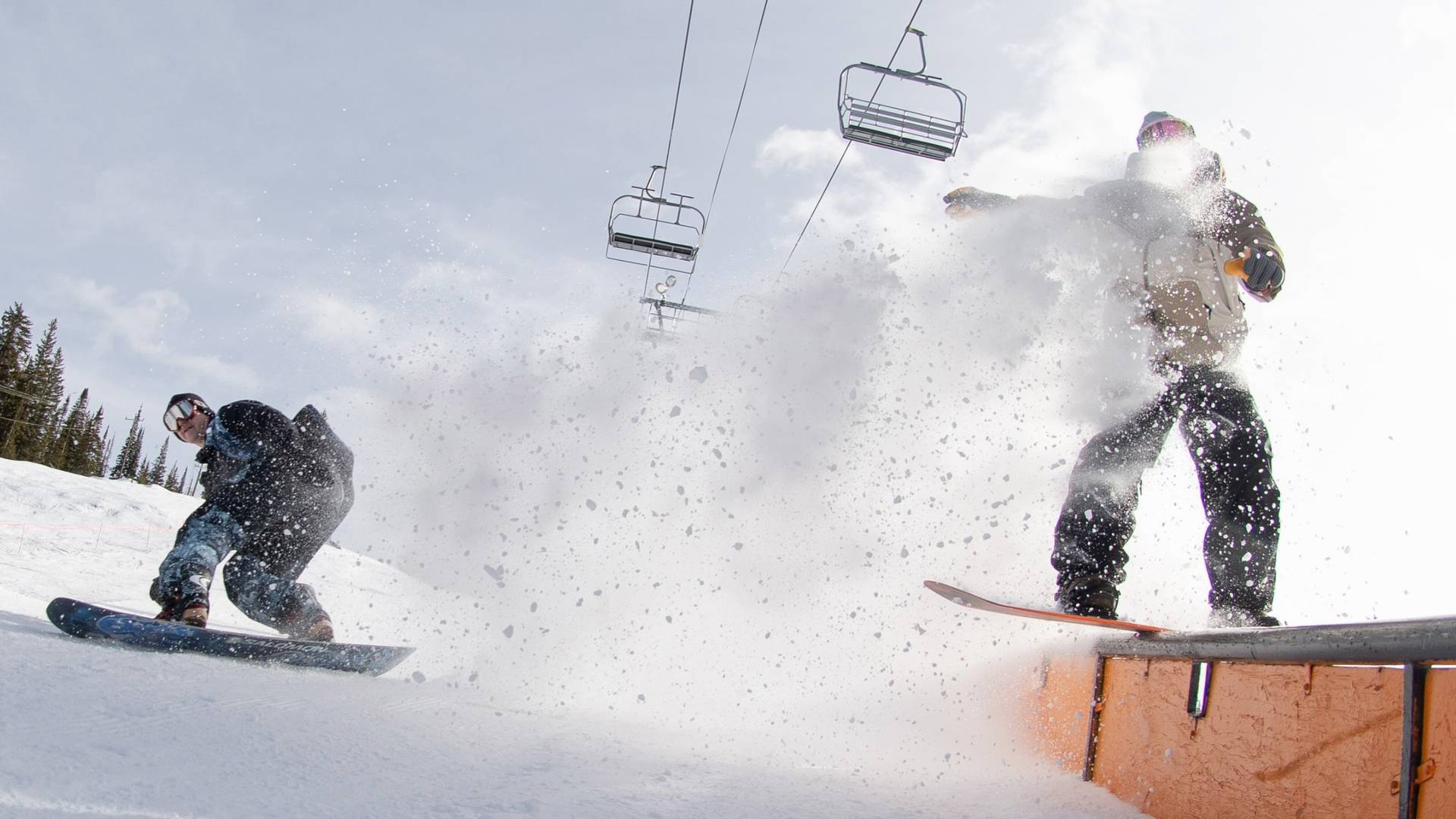 Snowboarders in Brighton Resort's terrain park