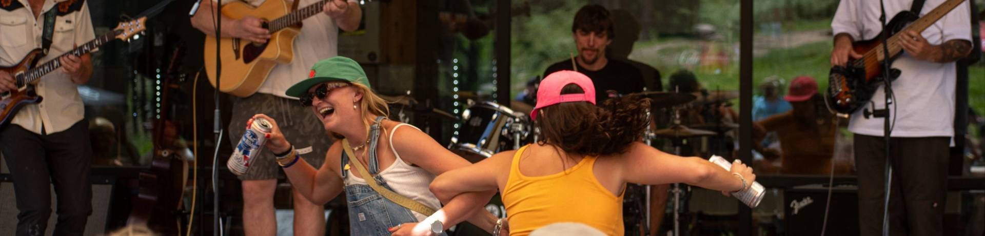 Friends dancing during live music at Brighton Resort in the summer