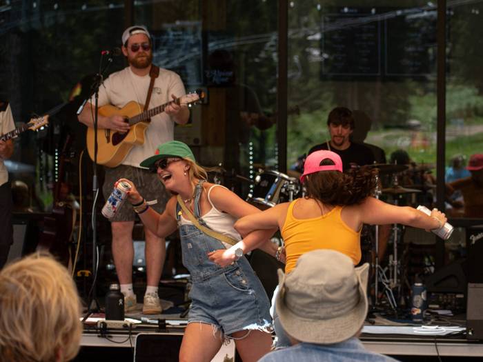 Friends dancing to live music at Brighton Resort in Utah